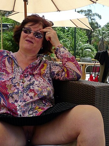 """
A bitch sits outside some fucking coffee shop with her legs open like a slut, probably showing off her pussy and titties.
"""