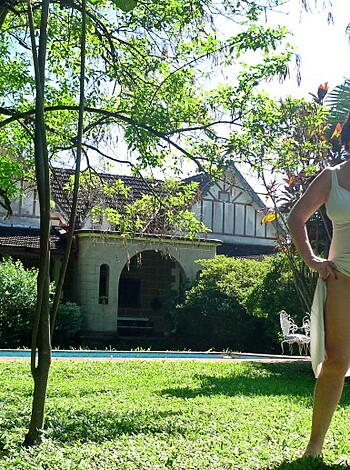 A chick with no pants, fuckin' around in her bitch ass yard.