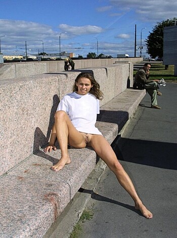 Here's an image of some hot chick with no clothes on, sittin' on a bench.