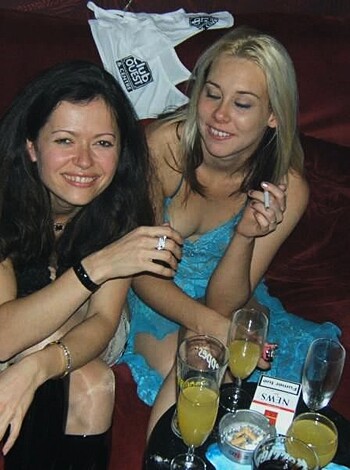 "Smokin' hot chick puffing away on a cancer stick while relaxing on her ass, legs spread wide."