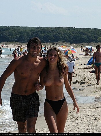 This limp dick piece of shit caption makes it seem like this couple is so goddamn in love that they can't keep their fucking hands off each other, as they stroll along the sandy shore, with the crashing waves and warm sun on their backs. Fucking disgusting.