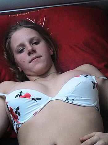 "Here's a pic of some bitch lying topless on a bed."