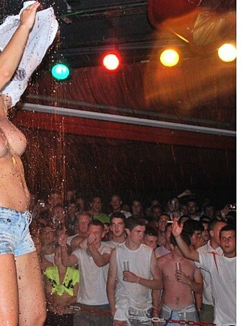 "A fucking topless bitch posing in front of some goddamn stage."