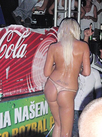 Here is a bare butt shot of some hot blonde bitch walking through the club with her shiny ass cheeks and everything, not even wearing any panties or anything, just fucking around like she doesn't give a fuck because she thinks she's so goddamn sexy and every dude in here wants to tap that sweet ass of hers.