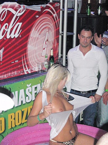 Fuckin hot bitch with shiny titties and ass cheeks hanging out, sporting that tight lil' piece of clothing around her waist.