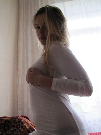 Here's the caption for this image: "Fuckin' hot babe cuppin' her titties, man!"