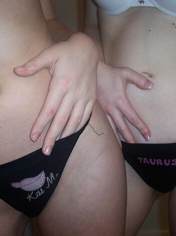 """
Close-up view of a pussy with a tattoo.
"""