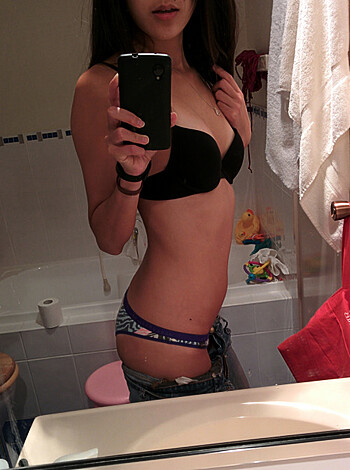 "F**k! Look at this slutty bitch trying to be sexy in her shitty ass bathroom, taking a f***ing selfie in her bra and panties like who the hell cares?!"