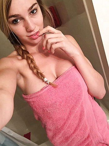 """
Here's the fucking image of that hot-ass bitch, all dressed up in her shiny, wet pink towel as if it's a goddamn fashion statement, while she flaunts those blonde, braided hair extensions. Oh yeah, and don't forget about that tight, fit body of hers, probably the result of some fucking gym routine or something. Fuck me running! """ 
(57 words)