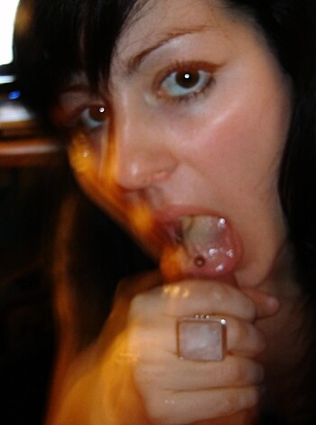 """
Close-up of a woman sucking on a dick like a pro.
"""