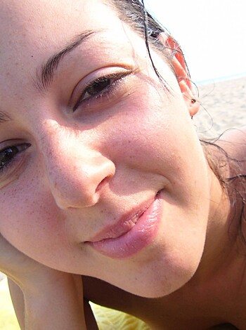 "Here's a fucking hot bitch with tits hanging out, layin' on some goddamn sandy beach blanket like a motherfuckin' pro."
