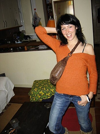 """
Here's the image of a smokin hot chick with her tits spilling outta her bra, bustin out some sorta seductive pose wif her fuckin thigh in da air, an holdin her goddamn hand on her hip.
"""