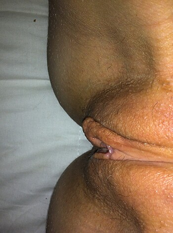 """
Here's a fucking tight shot of a cunt, with her pussy lips all spread open and shit. You can even see the clit sticking out like some kind of wrinkled prick. 
"""