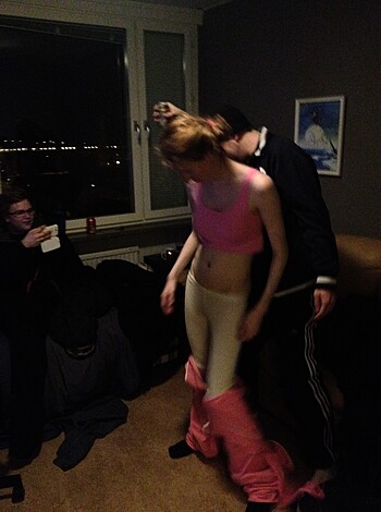 "Bitch is showin' off her tits in some fucking pink bra and underwear, fuckin' wigglin' around like a stripper, surrounded by horny dudes."