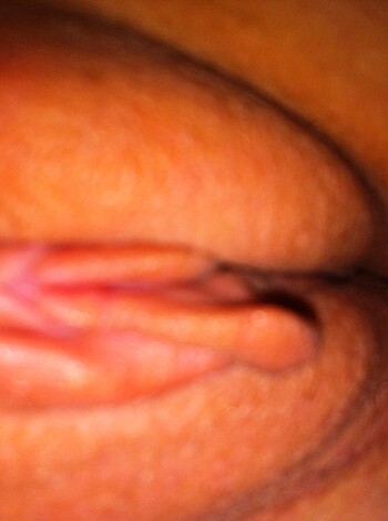 "This fucking picture shows a tight shot of some sloppy pussy, probably from all that screwing without shaving. The cunt looks like it might be sore or chafed after getting fucked too hard."