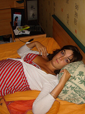 "This image shows a f*cking bitch lying on her back, wearing a goddamn sexy-as-f*ck red and white top."