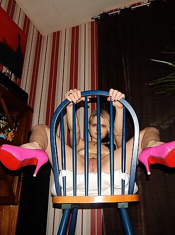 """
Look at this fat-ass bitch, all dolled up in her fucking stilettos, sitting there like she's some kinda goddamn princess or something. Fuckin' A right.
"""