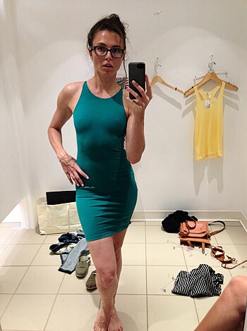Vulgar description:
"""
Fucking hell, look at this fat bitch trying to take a fuckin' sefie in that dumbass fuckin' green fuckin' dress while she shoves her stupid fuckin' tits out. Who the fuck cares? Fuck off!
"""