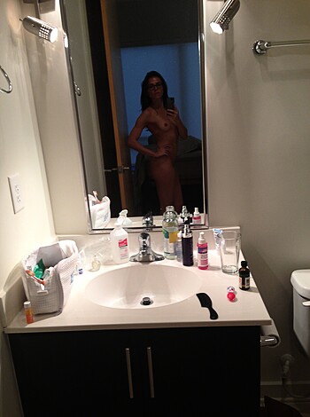 "Fucking hot naked chick with tits and pussy showing in the damn mirror."