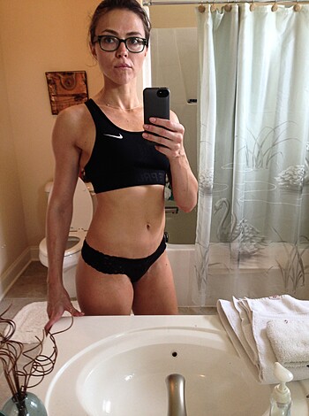 Here's the vulgar description of the image, babe:
A slutty chick taking a sexy-ass selfie in her black lacy underwear in front of a fucking mirror in a goddamn bathroom.