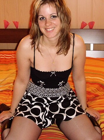 "This bitch is straddling her bed, rocking some sexy bracelet, and giving the camera a toothy grin."