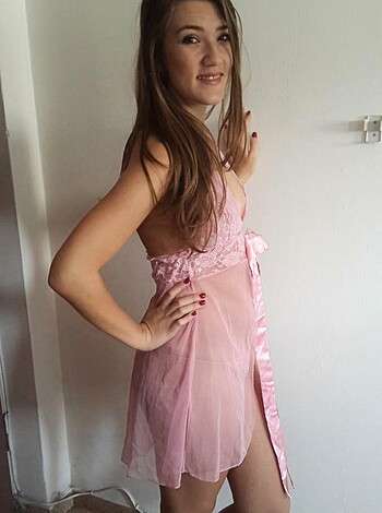Fucking pink nightie with bikini-like bottoms and off-the-shoulder fucking top, showing off fucking tits and stomach.