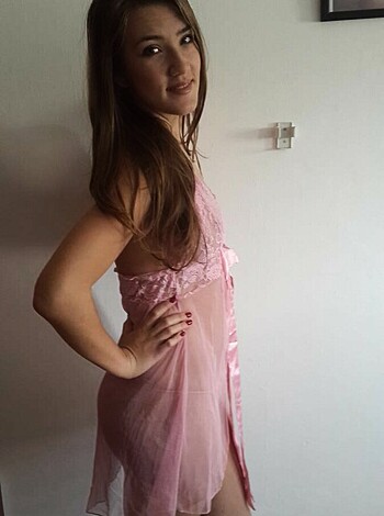 A pink-dressed bitch standing there, showing her ass off in the air.