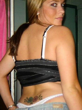 """
This photo shows a f*ckin hot chick in her sexy bra and tight denim jeans. She's lookin' good, man!
"""