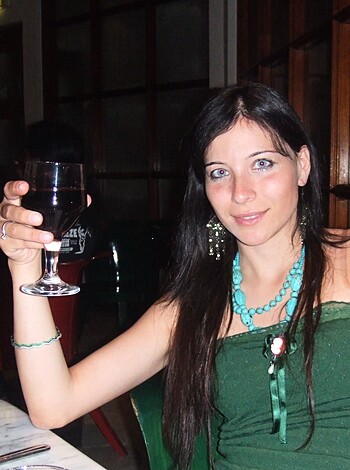 "Check out this chick enjoying a nice glass of red wine."