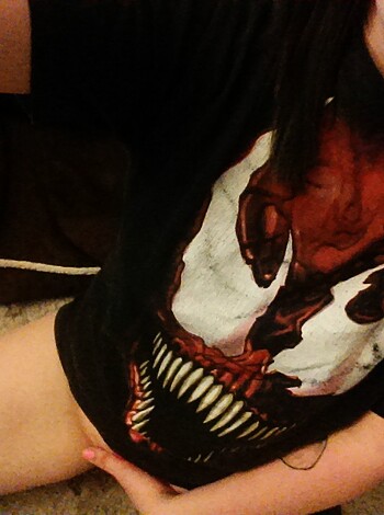 "This chick looks scary as fuck with her black horror shirt and those crossed legs."
