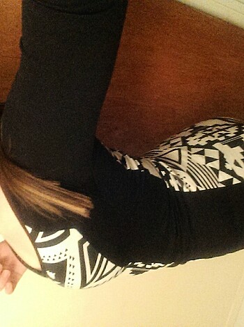"""
Hot chick dressed to fucking kill, legs spread wide on designer shoes.
"""