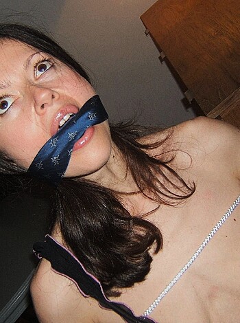 "This image features a tied-up bitch with her tits and snatch on full display."