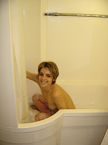 "A naked chick takes a bath."