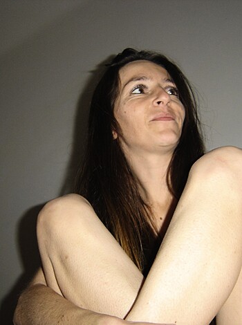 Here's a picture of a bitch with her shitty nude legs crossed, like fucking hell I care about your stupid caption dude, just show me the damn image.