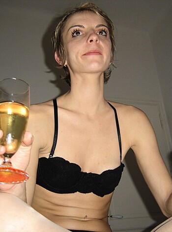 This photo depicts a chick with her tits hanging out, sippin' on some merlot and blowing smoke rings.