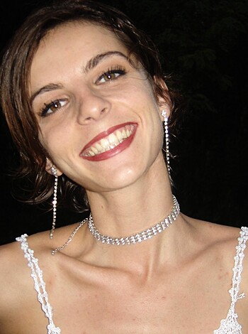Look at this f***ing picture of some hot-ass chick wearing a tight-ass dress, showing off her tits while she's all smiley-faced and sh*t!