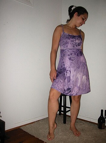 Here's a bitch in a goddamn purple fucking dress, taking her barefeet off.