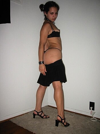 Vulgar description of image: Fucking hot naked bitch with sexy panties and high heels posing seductively on camera.