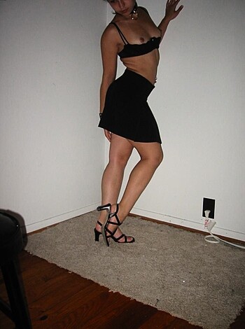 "Fuck me pumps, stockings, and a wall in the background frame this hot bitch's ass."