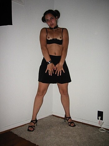 """
Here's some fuckin hot chick in a tight black suit, standin ass-out in some fucked up room, with a boring wall behind her.
"""