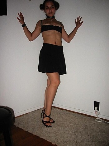 A hot chick strips down to her skimpy lingerie and puts on some kinky high heels before the camera snaps a shot of her tight ass.