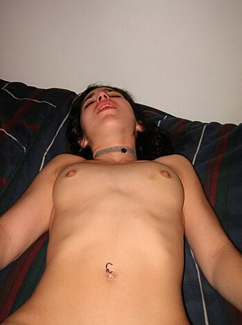 Here's a fucking picture of some chick taking her top off on a goddamn bed, if you don't mind my vulgar language.