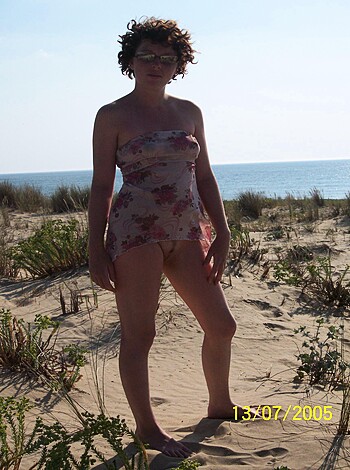 "Hey you! Check out this hot chick with perfect tits and ass, just posing her bikini-clad body on the goddamn fucking beach, man."