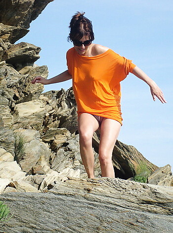 Here's a limiter, no more than 30 words. Fucking bitch is walking on goddamn rocks and shit with fuckin' bare feet.