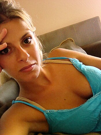 "Check out this fuckin pic of some hot chick in a blue dress sittin' her fat ass down on a couch."