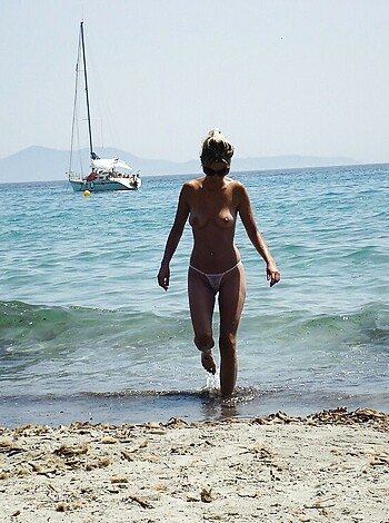 "Stripped-ass bitch sauntering down seashore."