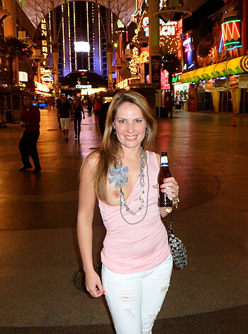"Fucking hot babe with tits out and a beer in her hand, grinning like a fucking idiot."