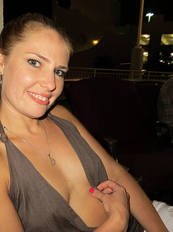 Here's a vulgar description of an image: "Breasties hangin' out."