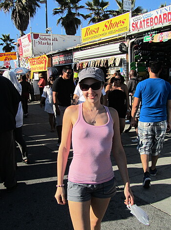 "Check out this f*cking picture of some hot chick with a fancy fedora and shades hanging out at the goddamn farmers' market while all these assholes in suits jabber away like godd*mn monkeys."