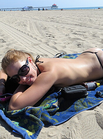 "Here's a fucking pic of some hot chick sunbathin' ass-naked on a goddamn beach, bro!"